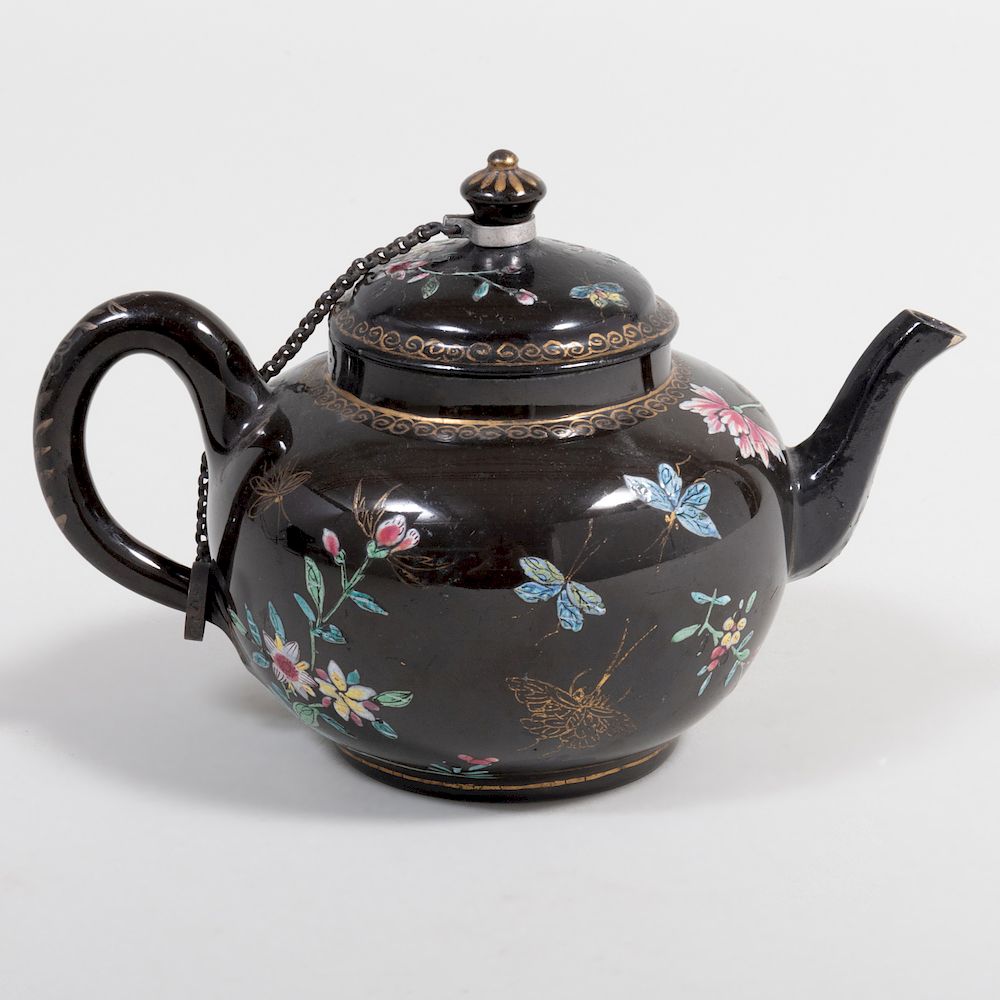 Appraisal: Staffordshire Pottery Black Ground Teapot and Cover in wide over