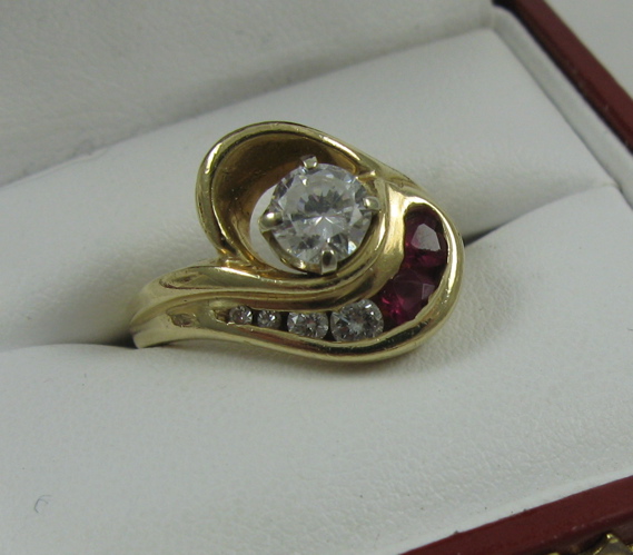 Appraisal: DIAMOND AND RUBY RING K yellow gold estimated weight of