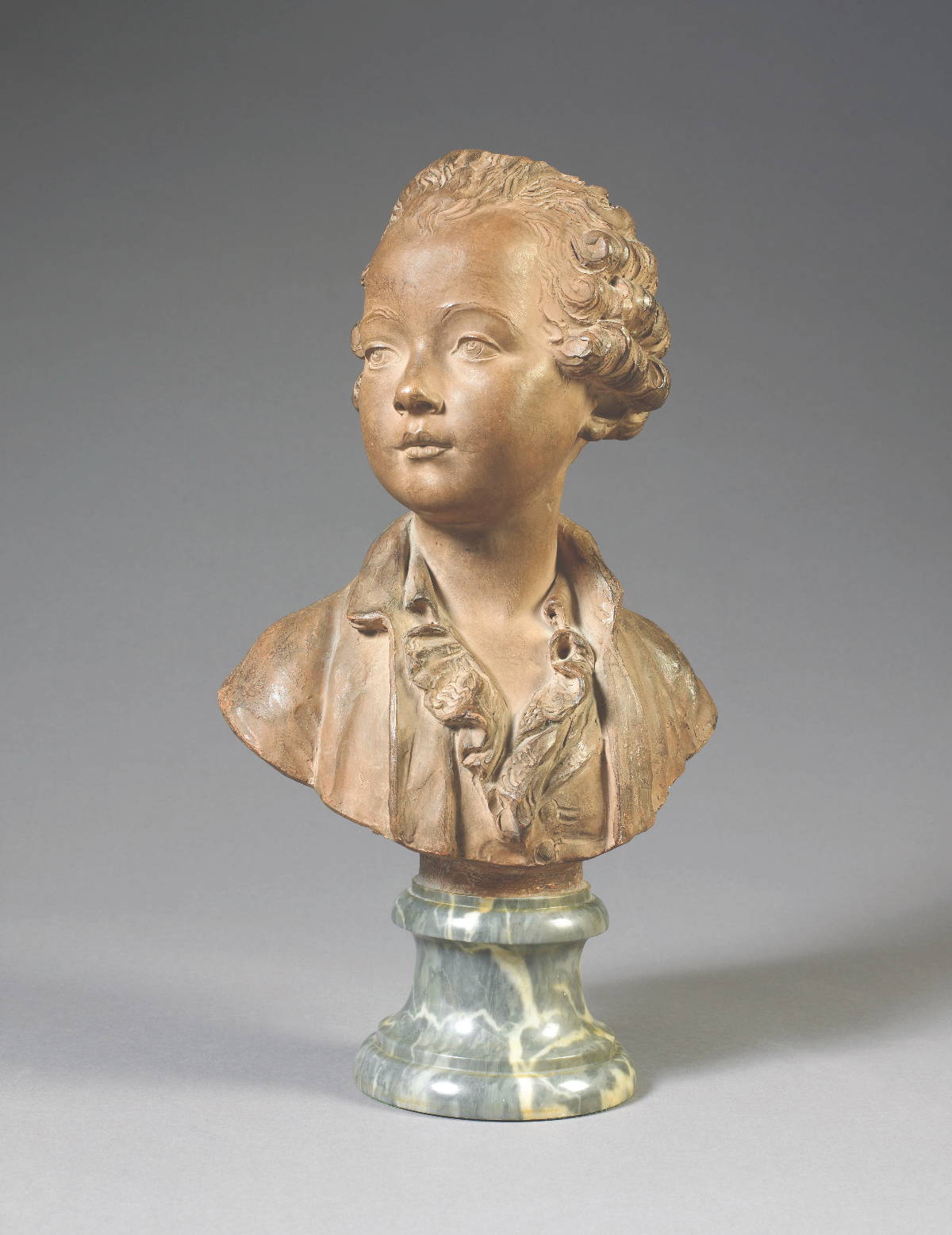 Appraisal: FRENCH TERRACOTTA BUST OF A YOUNG BOY Signed indistinctly and