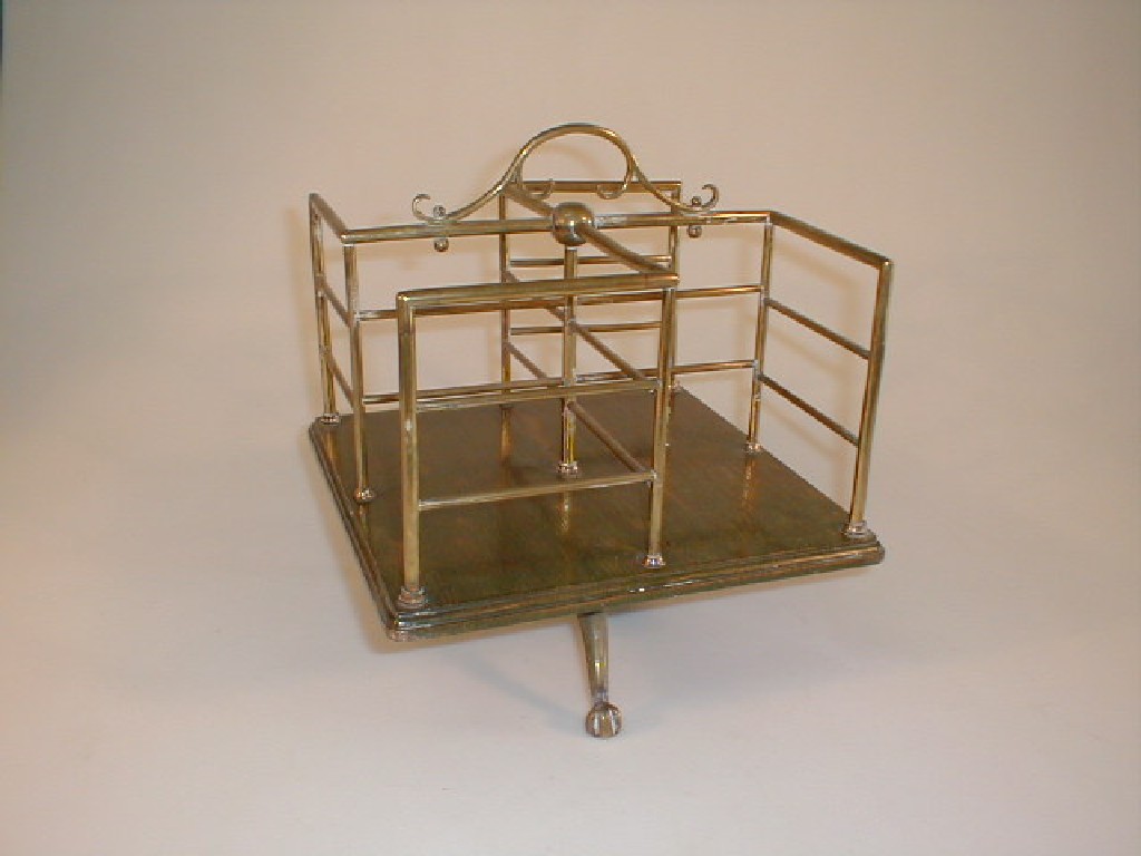 Appraisal: A thC brass railed revolving table-top book stand with a