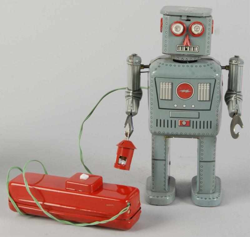 Appraisal: Tin Litho Powder Robot Battery-Operated Toy Description Japanese Working Made