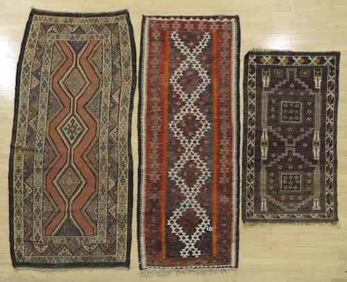 Appraisal: Two flat wave carpets together with a Baluch largest -