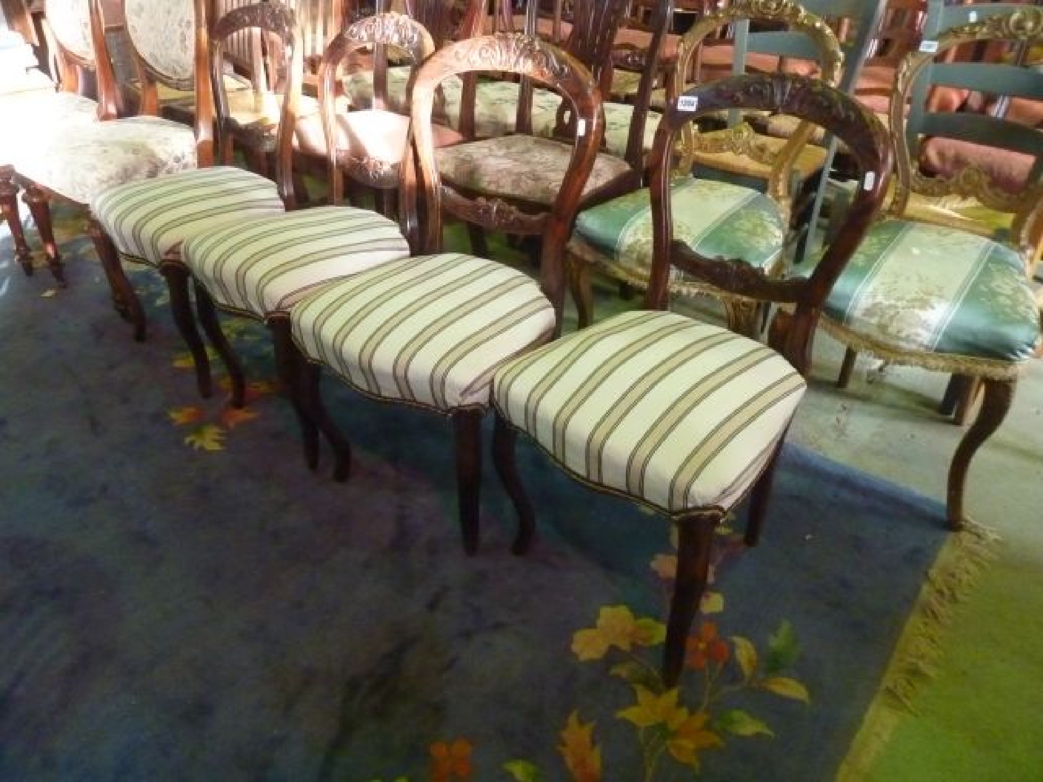 Appraisal: A set of four Victorian walnut balloonback dining chairs with