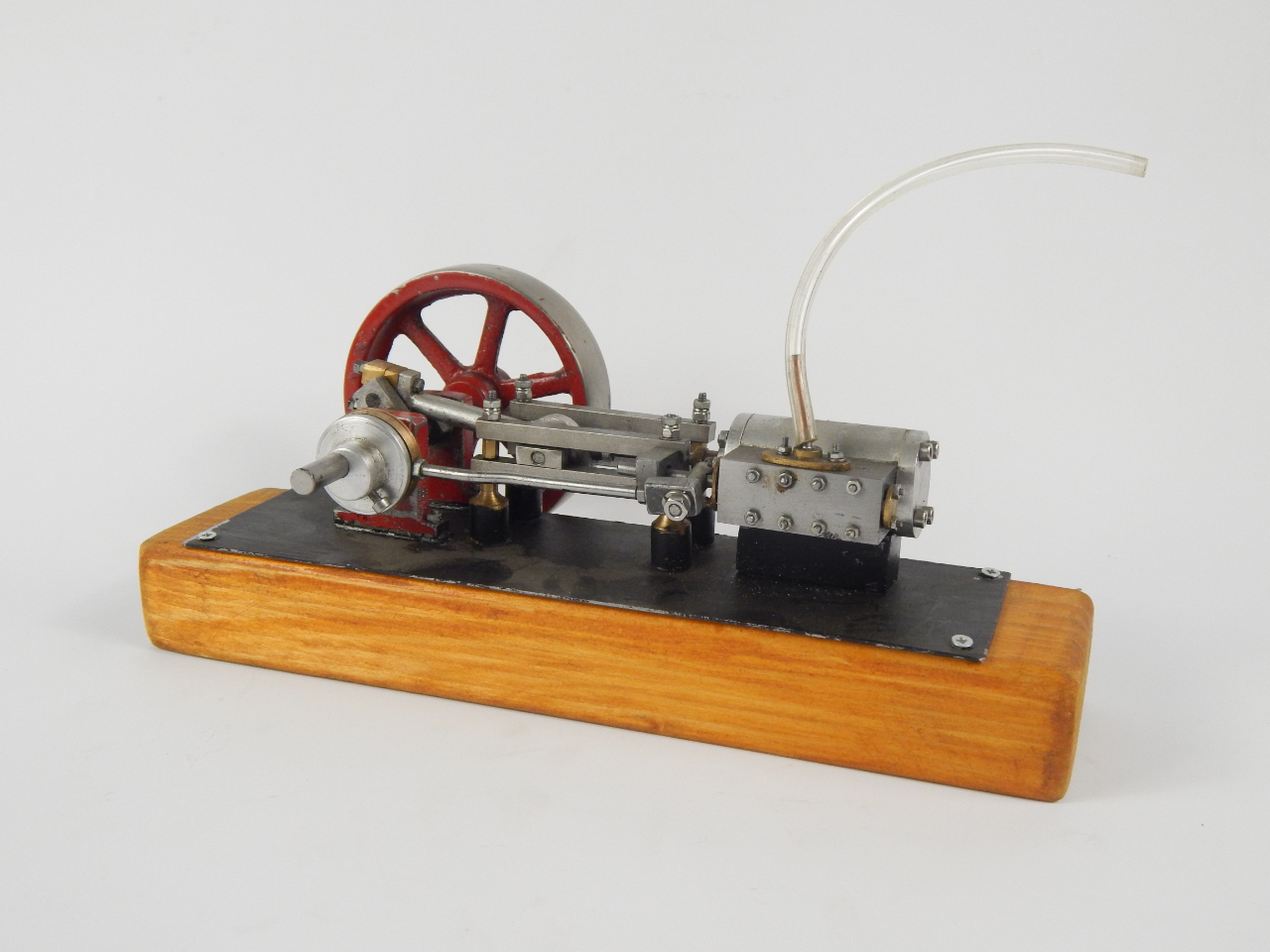 Appraisal: A thC horizontal stationary engine with pierced cm diameter flywheel