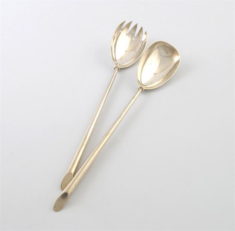 Appraisal: A pair of late-Victorian silver salad servers