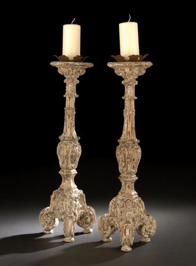 Appraisal: Pair of Northern Italian Carved and Silvered Wood Tripodal Candlesticks