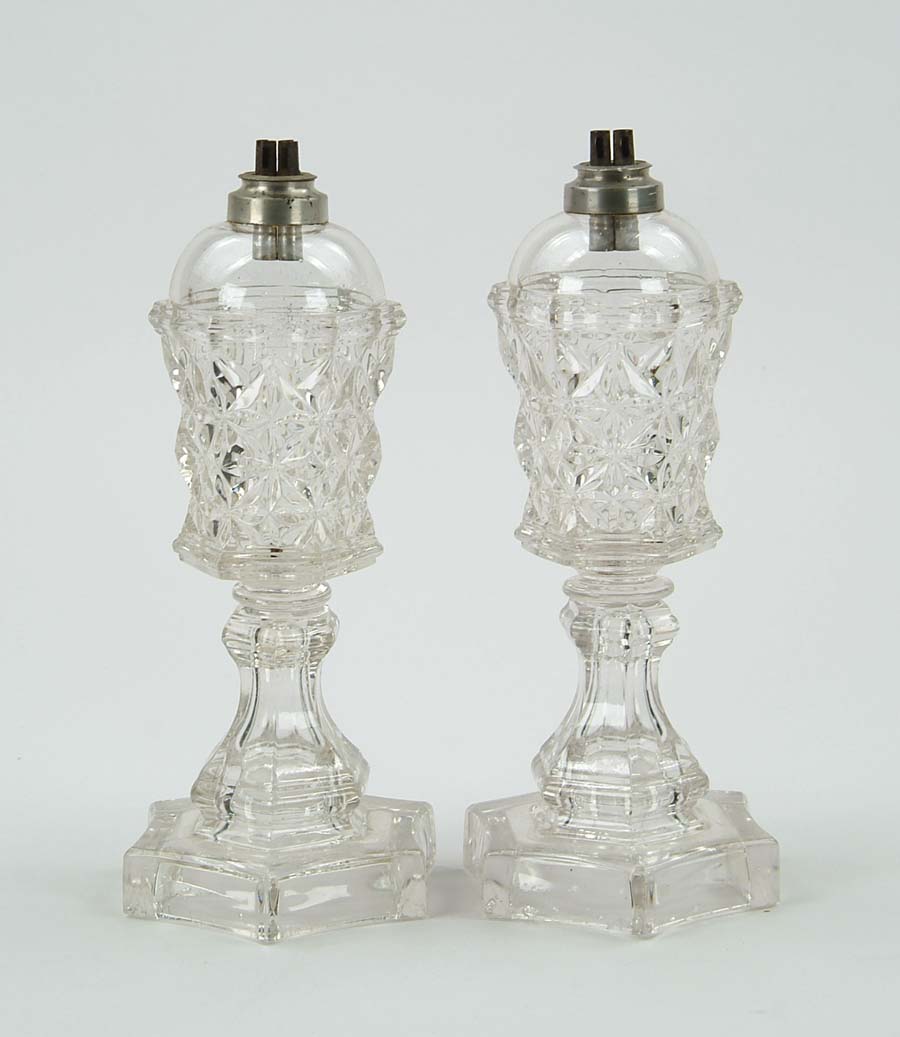 Appraisal: PAIR OF SANDWICH GLASS WHALE OIL LAMPS In the Sandwich