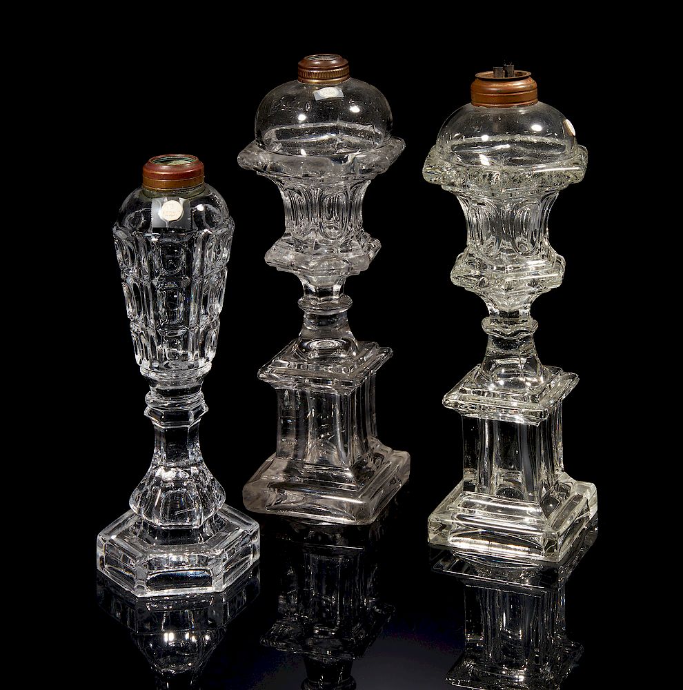 Appraisal: Three Oil Lamps Three clear glass oil lamps no chimneys