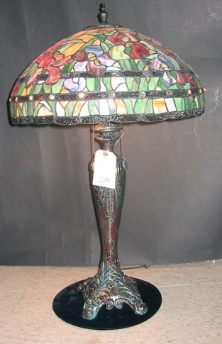 Appraisal: AN IRIS PATTERN STAINED AND LEADED GLASS TABLE LAMP The