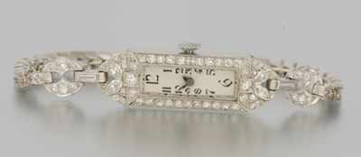 Appraisal: A Ladies' Platinum Gold and Diamond Watch Platinum elongated case