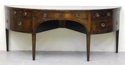 Appraisal: A GEORGE III MAHOGANY SIDEBOARD of demi lune form with