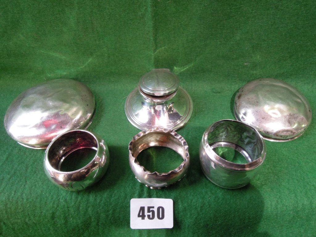 Appraisal: A capstan silver inkwell three varied napkin rings and two