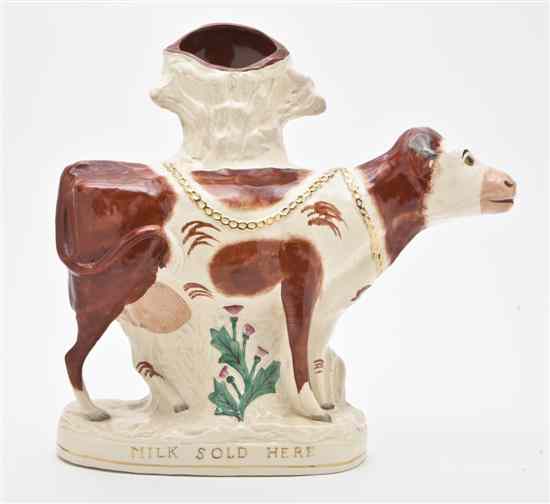 Appraisal: A Staffordshire Style Cow late th century depicted standing in