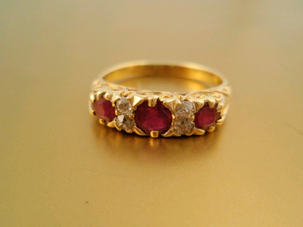 Appraisal: A diamond and ruby in-line ring of three rubies inter