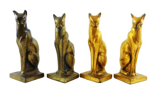 Appraisal: Four cast-metal seated cat bookends gilt finished pair one with