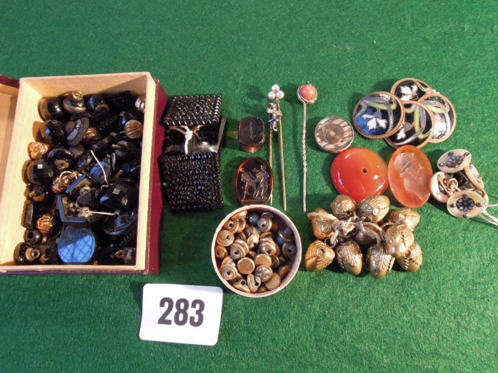 Appraisal: A mixed collection of enamelled buttons polished stones etc