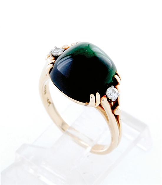 Appraisal: Green tourmaline ring cabochon-cut green tourmaline approximately ct two round-cut