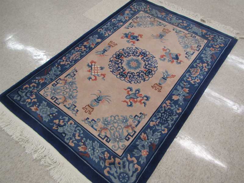 Appraisal: A CONTEMPORARY CHINESE AREA RUG hand knotted in traditional Peking