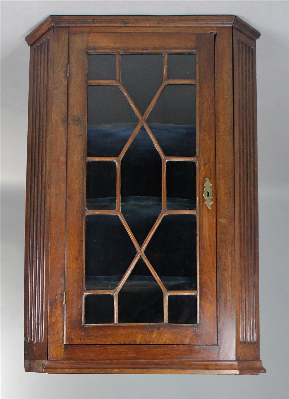 Appraisal: CHIPPENDALE STYLE MAHOGANY HANGING CORNER CUPBOARD the molded cornice over