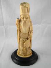 Appraisal: An oriental ivory of a bearded figure holding a staff