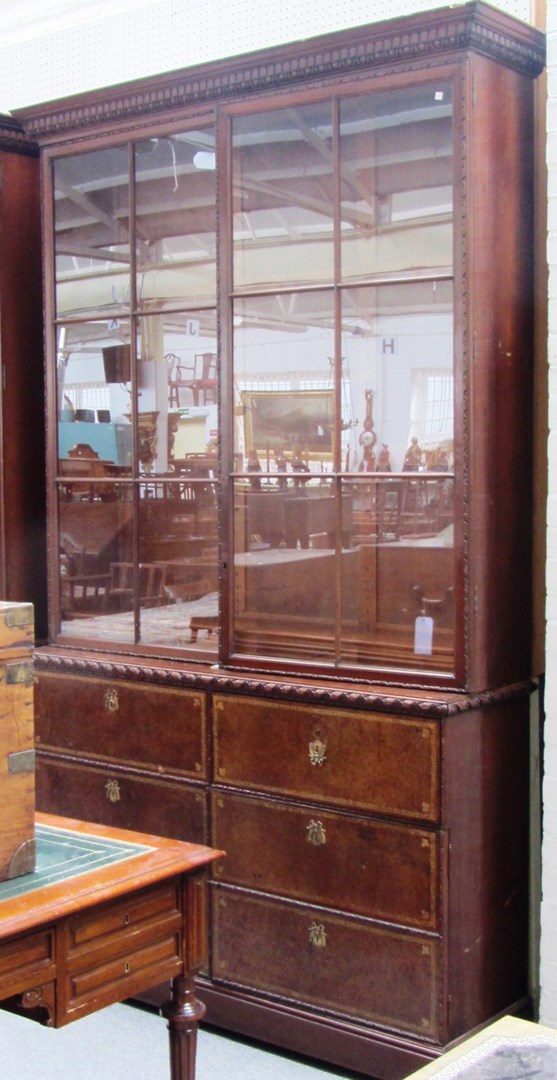 Appraisal: A pair of mahogany bookcase cabinets each with pair of