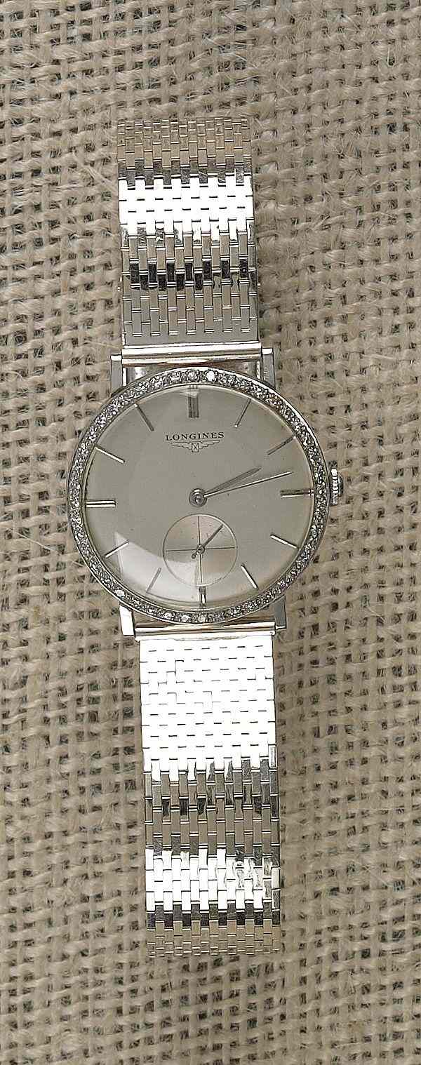 Appraisal: Man's white gold Longines wrist watch marked K with round