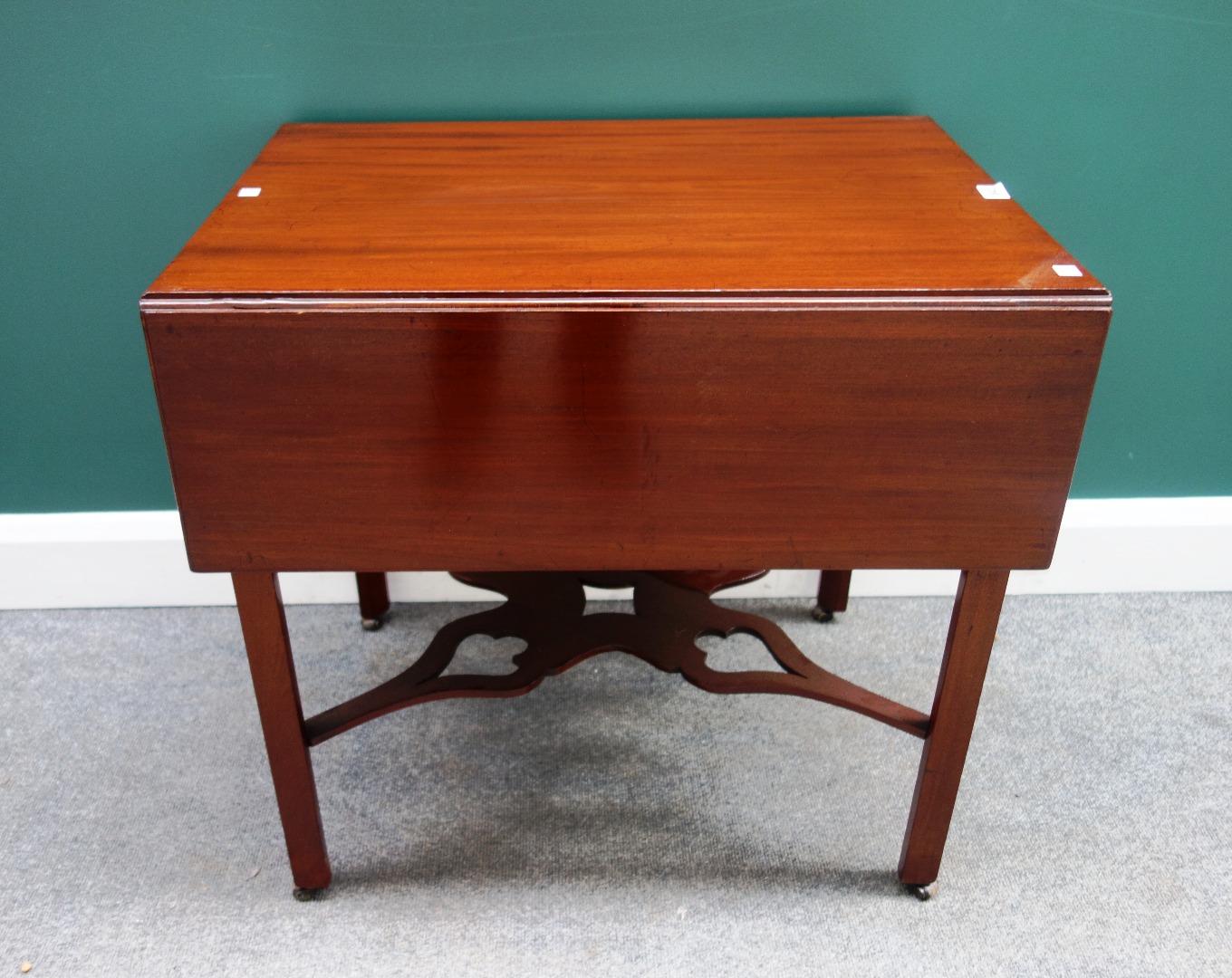 Appraisal: A mid th century mahogany drop flap table with single