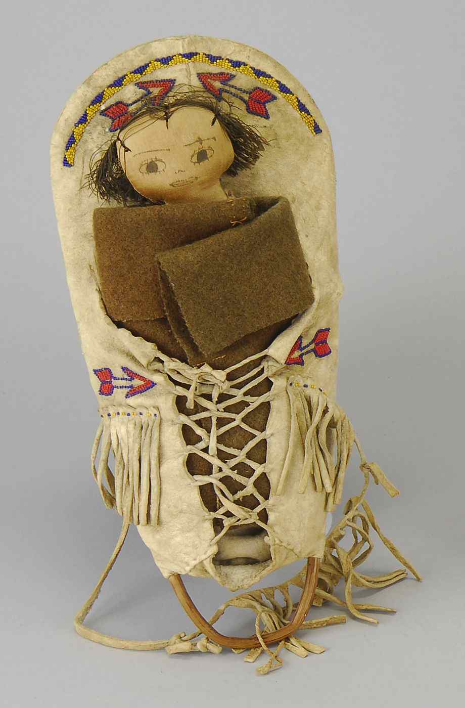 Appraisal: AMERICAN INDIAN BEADWORK AND DEER HIDE DOLL'S PAPOOSE RACK WITH