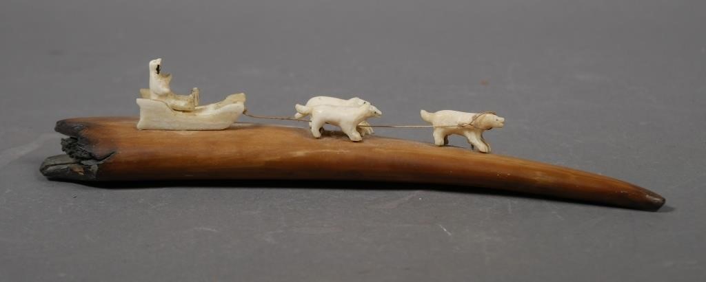 Appraisal: Vintage carved sculpture of dog sled mounted on a section