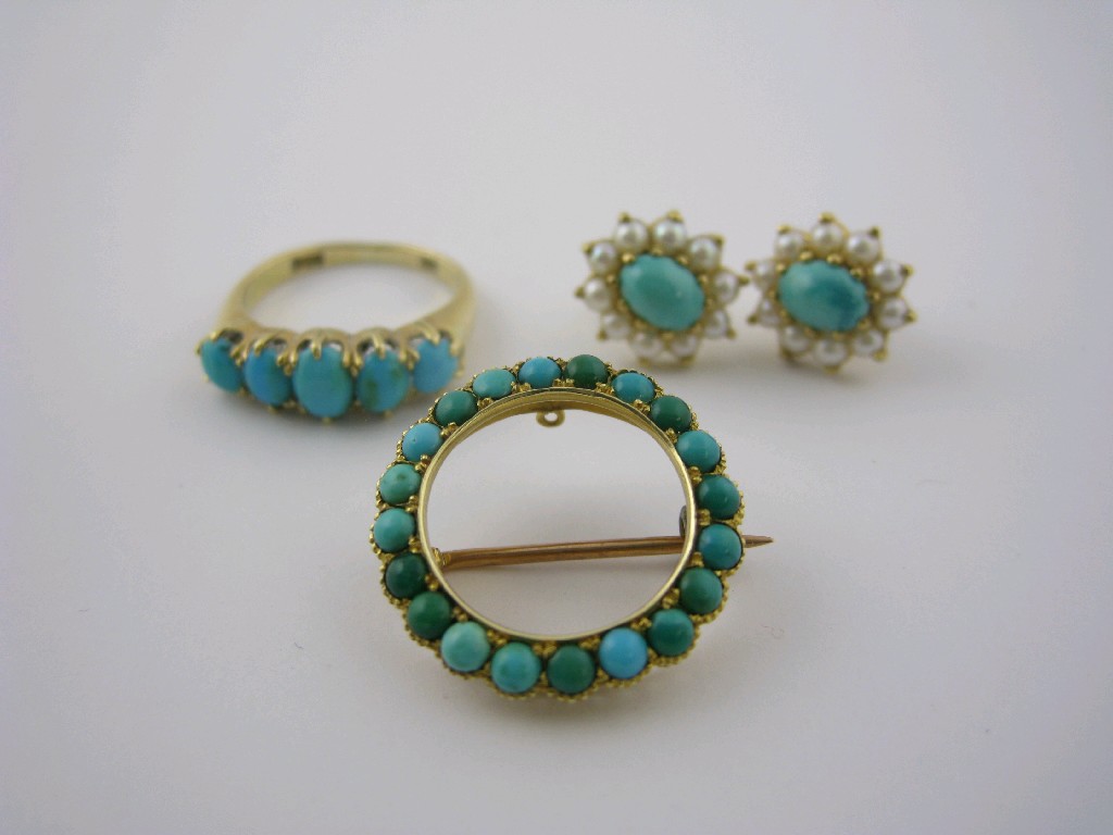 Appraisal: An ct gold Turquoise Ring set five graduated oval cabochons