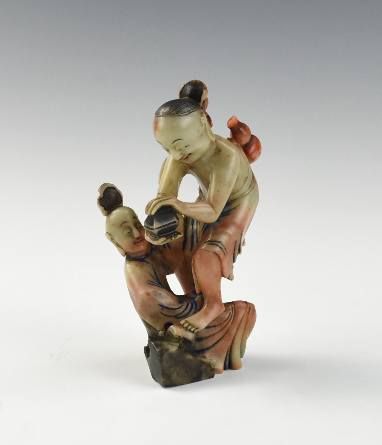 Appraisal: CHINESE SOAPSTONE CARVING OF COUPLES Chinese carved standing of a