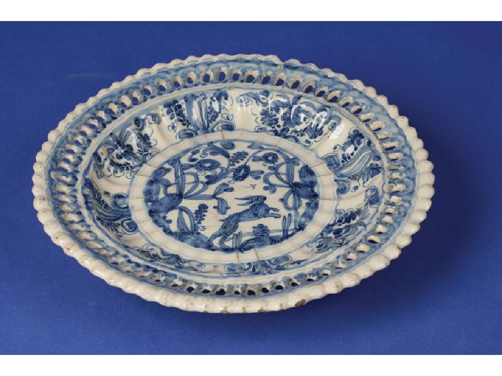 Appraisal: A DELFTWARE BLUE AND WHITE STAND of lobed circular form