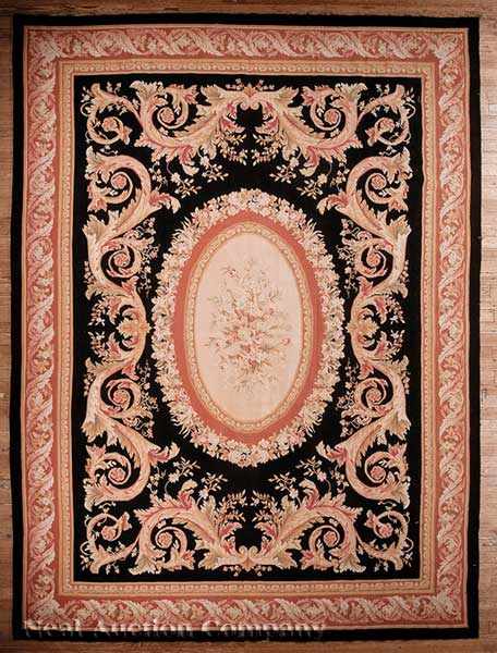 Appraisal: An Aubusson Carpet black ground with cream and salmon central