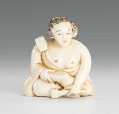 Appraisal: Carved Ivory Netsuke of Seated Figure Seated figure in robes