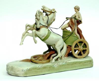 Appraisal: A ROYAL DUX PORCELAIN FIGURE GROUP of a charioteer with