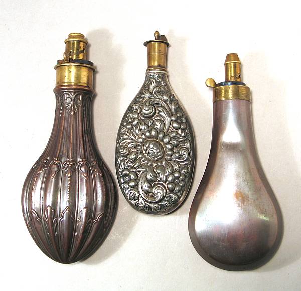 Appraisal: A lot of three th century powder flasks Comprising Unusual