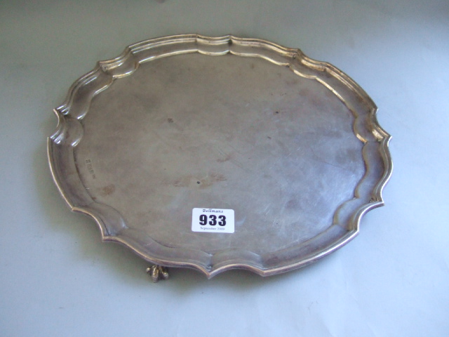 Appraisal: A silver shaped circular salver with a piecrust rim raised