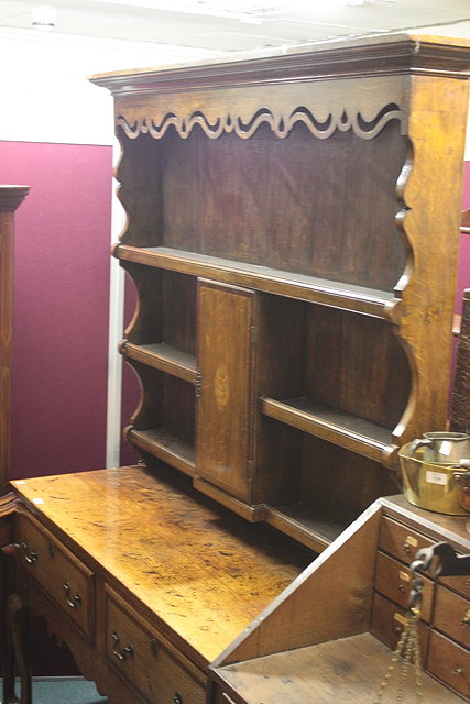 Appraisal: A TH CENTURY OAK DRESSER having a raised open shelf