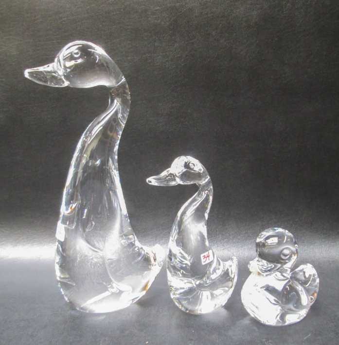 Appraisal: THREE STEUBEN CRYSTAL DUCK SCULPTURES Rubber Ducky Great Duck and