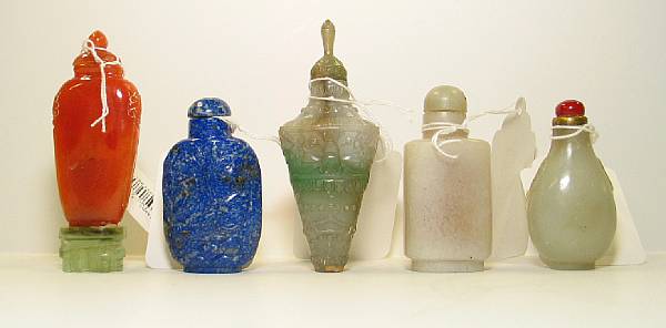 Appraisal: Five hardstone snuff bottles Including one of carnelian one of