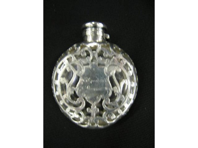 Appraisal: Victorian Silver Overlay Perfume Bottle disc shape purse model ornate