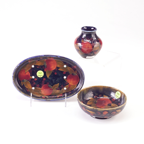 Appraisal: MOORCROFT Three pieces in the Pomegranate pattern footed bowl small