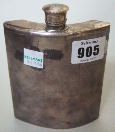 Appraisal: A curved rectangular spirit flask with a screw off top