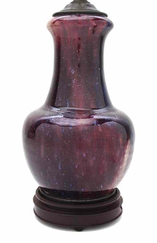 Appraisal: A Glazed Sang de Boeuf Flambe Vase of baluster from