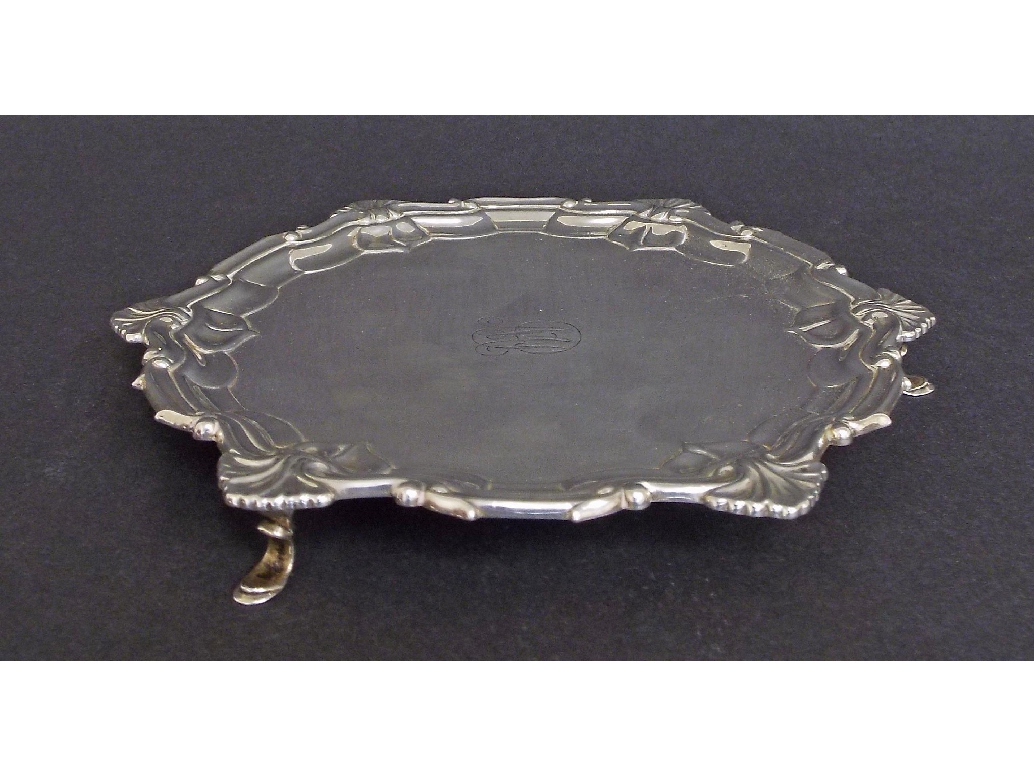 Appraisal: Georgian style silver waiter with scalloped rim and four hoof