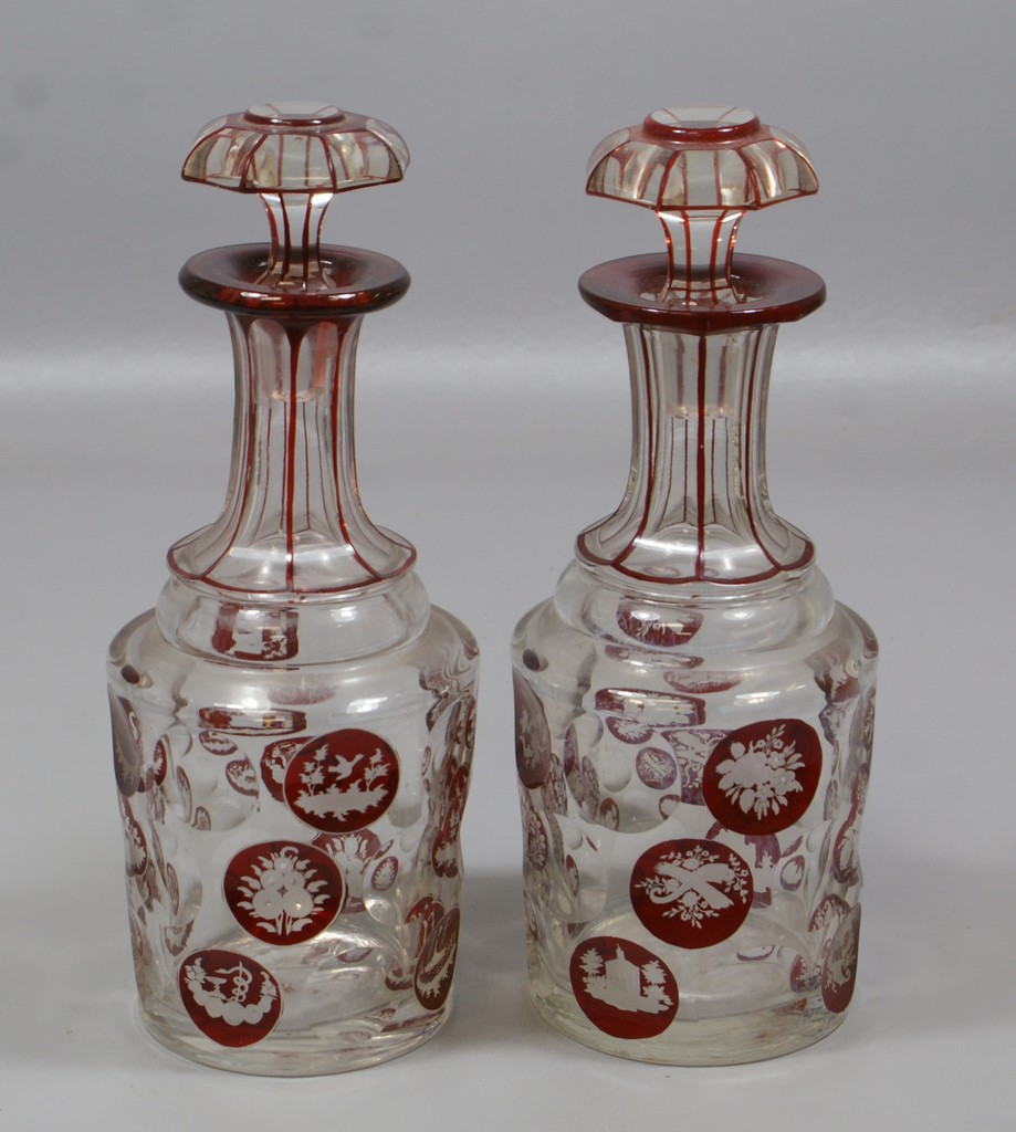 Appraisal: Bohemian cranberry flashed engraved to clear faceted crystal decanters with