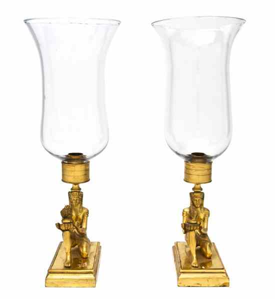 Appraisal: A Pair of Egyptian Revival Brass Candlesticks each cast in