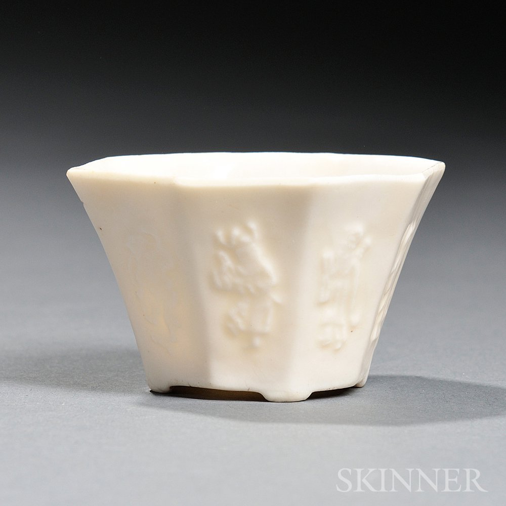 Appraisal: Small Blanc-de-Chine Libation Cup China compressed octagonal form supported by