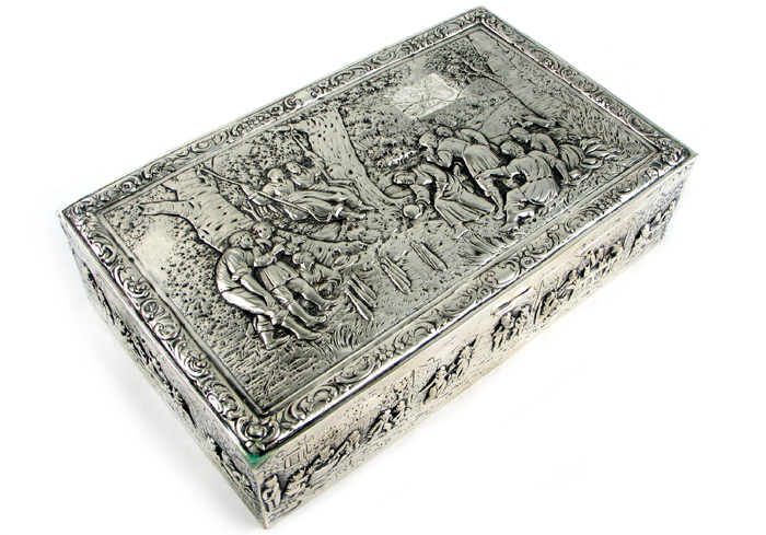 Appraisal: A CONTINENTAL SILVER REPOUSSE BOX with parcel gilt interior marked