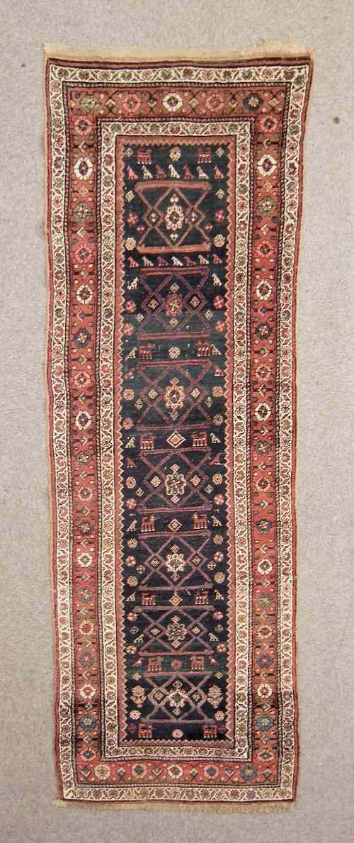 Appraisal: An Antique North-West Persian runner woven in colours with geometric